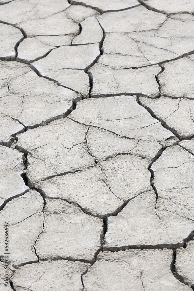 Obraz premium cracked up topsoil in a catastrophic drought in summer