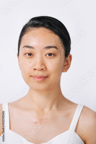 Asian woman with bare face after washing her face