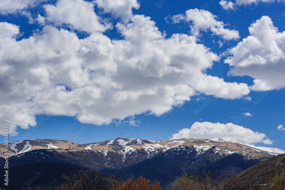Spring landscape with snowy mountains Spring landscape with snowy mountains