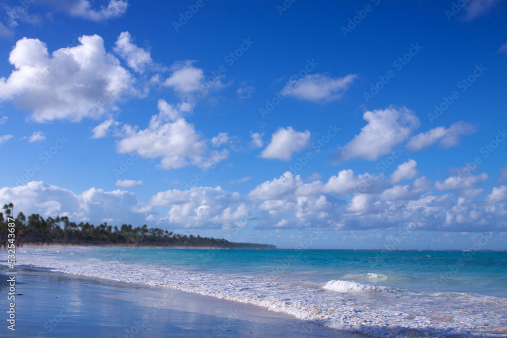 Travel background with Caribbean sea and clouds sky.