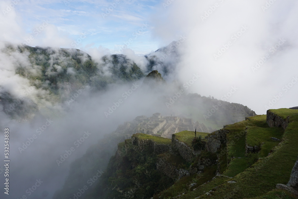 Overview of Machu Picchu, agriculture terraces and Wayna Picchu peak in the background, Peru