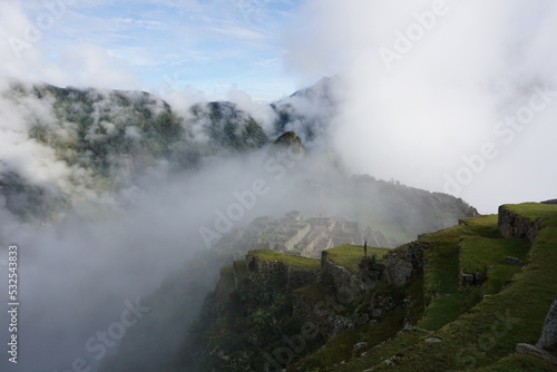 Overview of Machu Picchu, agriculture terraces and Wayna Picchu peak in the background, Peru