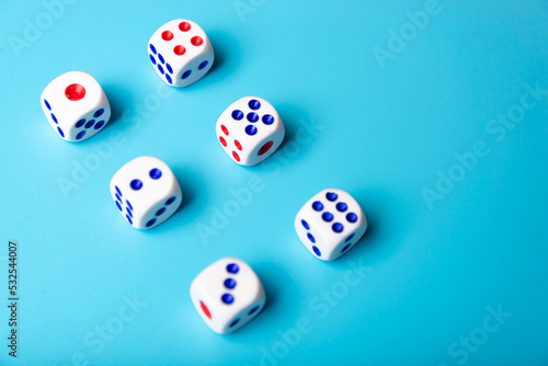 cubes with numbers on a blue background. dice