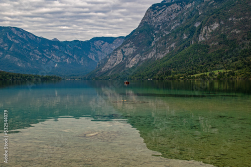 view over lake Bohinj and the julian alps in Slovenia photo