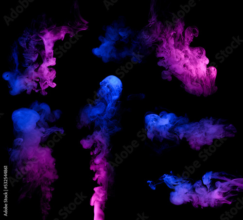 Clouds of colorful neon blue and purple smoke puffs design elements isolated on black background