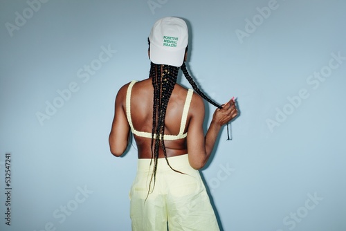 Anonymous black woman seamless background braids hairstyle photo