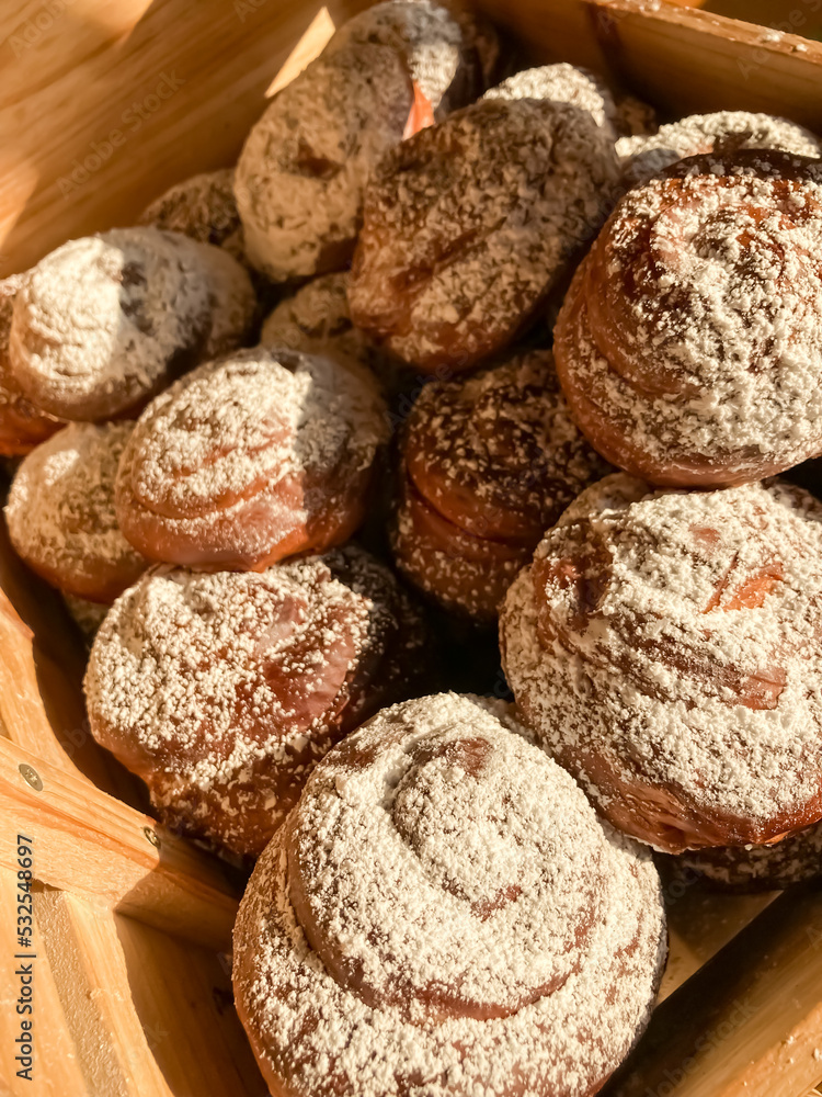 Fresh pastries in a wooden box. Fresh pastries in a wooden box.