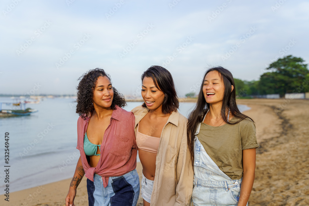 Three friends enjoying vacation together at beach Three friends enjoying vacation together at beach