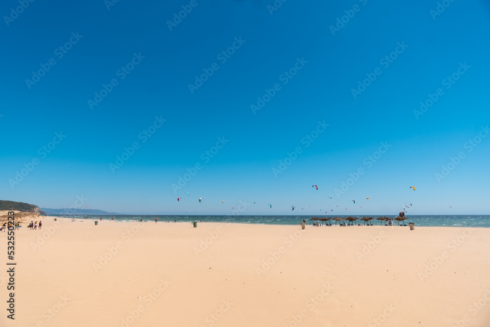 Kitesurf sport on the Caños de Meca beach on the Costa de la Luz, Cadiz. Andalusia
