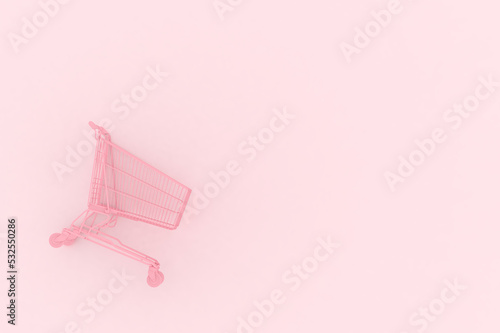 Obraz na plátne Pastel pink shopping cart on pink background