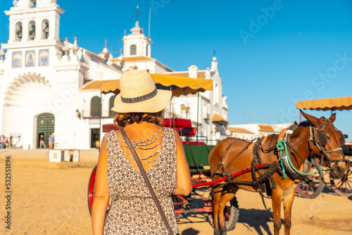A tourist with horses at the El Rocio sanctuary at the Rocio festival, Huelva. Andalusia