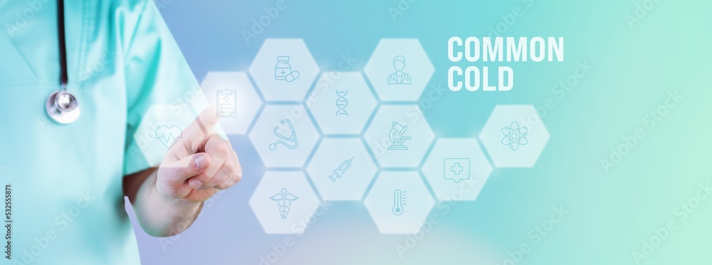 Common cold. Male doctor pointing finger at digital hologram made of icons. Text with medical term. Concept for digitalization in medicine Common cold. Male doctor pointing finger at digital hologram made of icons. Text with medical term. Concept for digitalization in medicine