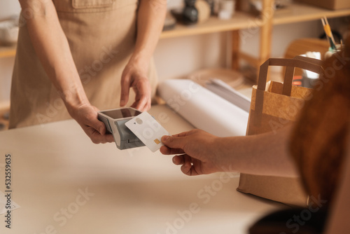 Close Up Of An Anonymous Customer Paying With A Credit Card 