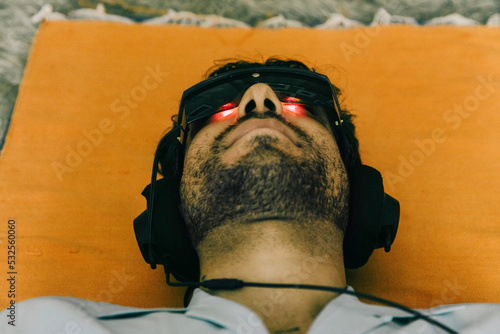 Anonymous Young Man Using Brain Machine for Mental Health photo