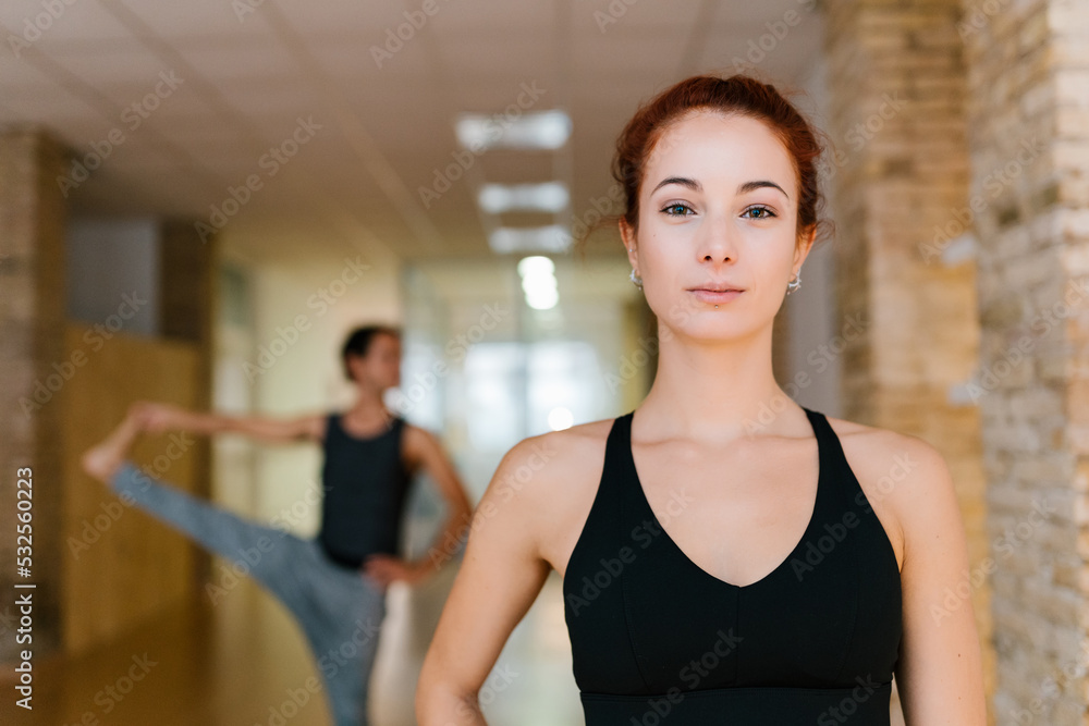 Woman standing in yoga studio Woman standing in yoga studio