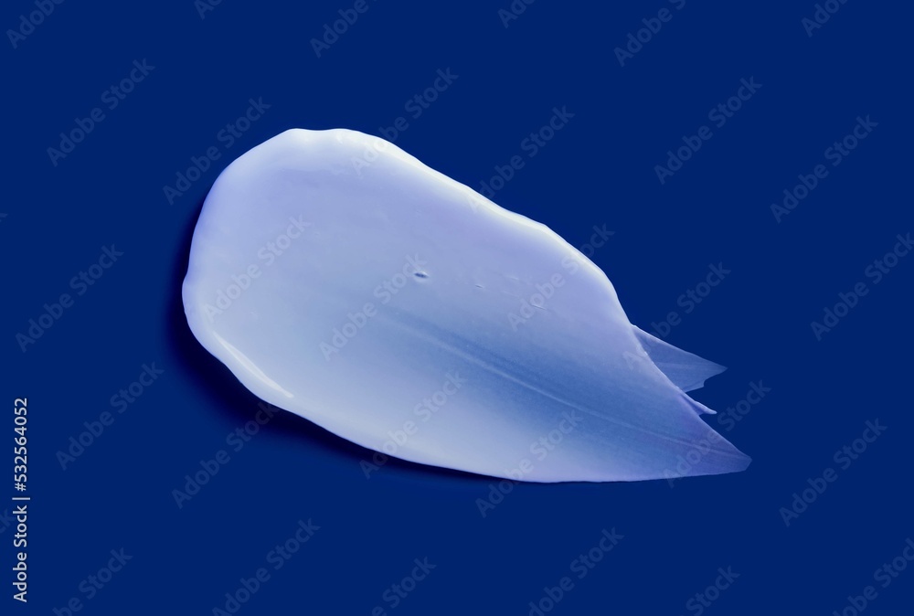 Face or body white cream hair balm deep navy blue background Face or body white cream hair balm deep navy blue background