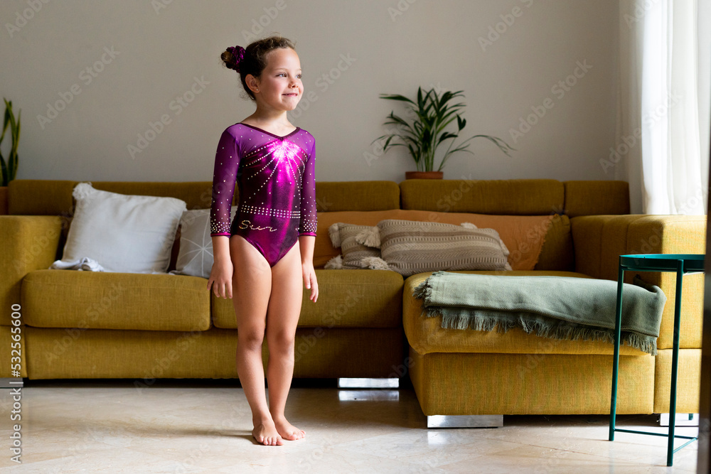 little girl practicing artistic gymnastics at home little girl practicing artistic gymnastics at home