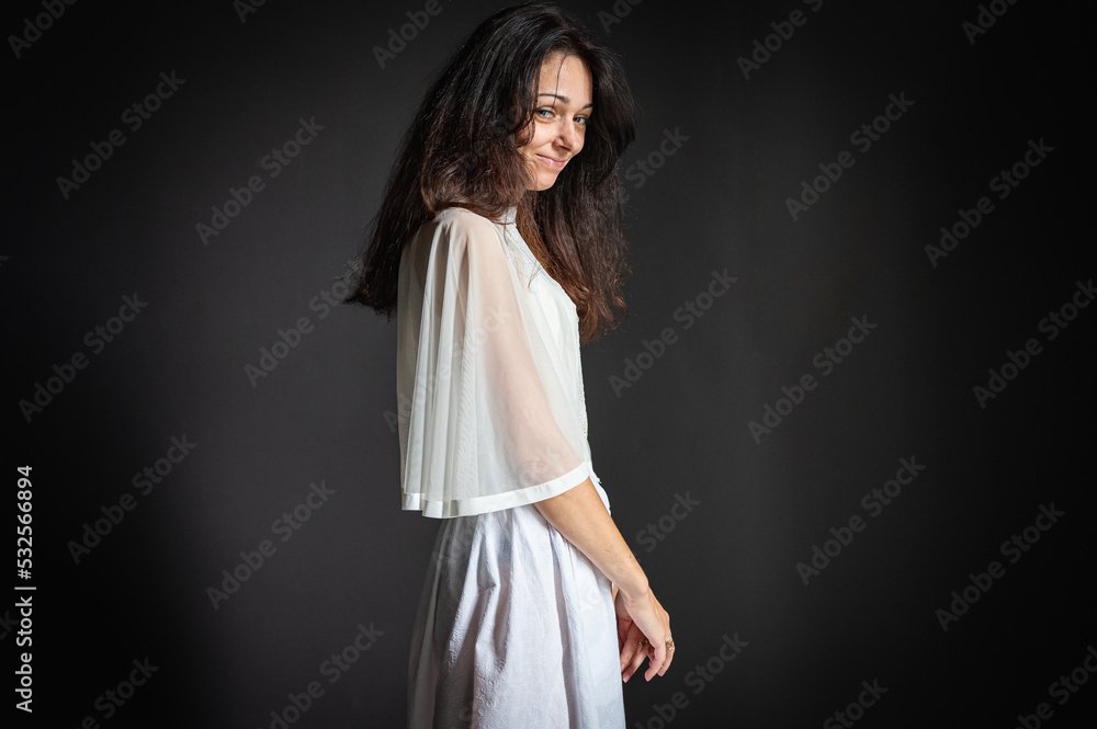 Portrait of pensive, cheerful, mysterious young lonely desperate woman holding head with hand, smiling despite having problem or headache. The concept of cheerful despair Portrait of pensive, cheerful, mysterious young lonely desperate woman holding head with hand, smiling despite having problem or headache. The concept of cheerful despair
