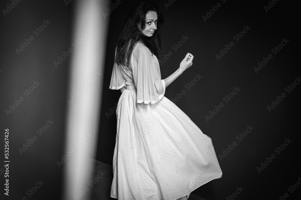 Confused emotional young girl looking aside with skeptical and suspicious emotions, thoughtful and pensive while making a decision. Portrait of a sarcastic woman, on a gray background. Selective focus Confused emotional young girl looking aside with skeptical and suspicious emotions, thoughtful and pensive while making a decision. Portrait of a sarcastic woman, on a gray background. Selective focus
