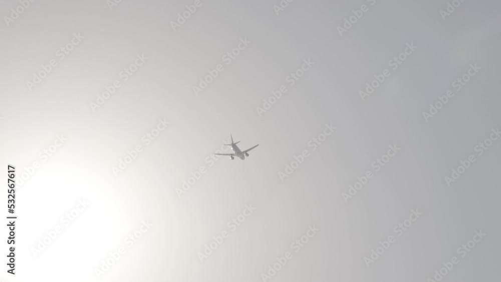 the plane flies against the background of the sun the plane flies against the background of the sun