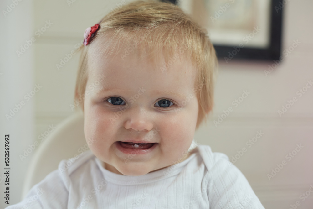 Cute baby showing first tooth Cute baby showing first tooth