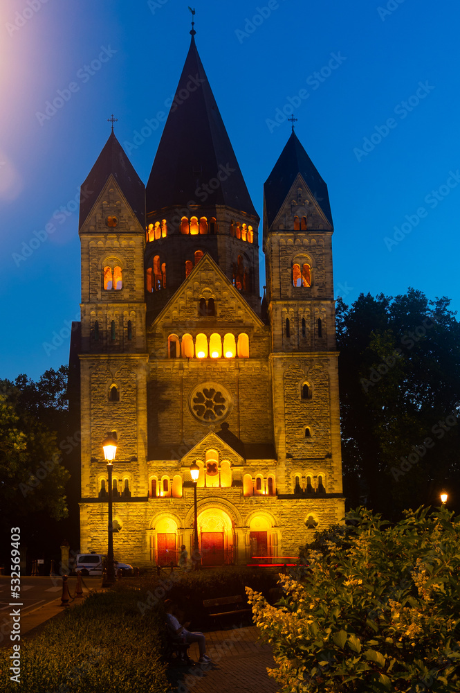 Temple Neuf (New Temple) of Metz in evening, illuminated by city lights. Protestant church in Grand Est region, France.