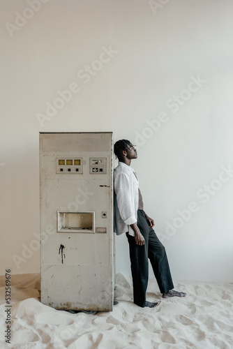 Man near old vending water machine photo