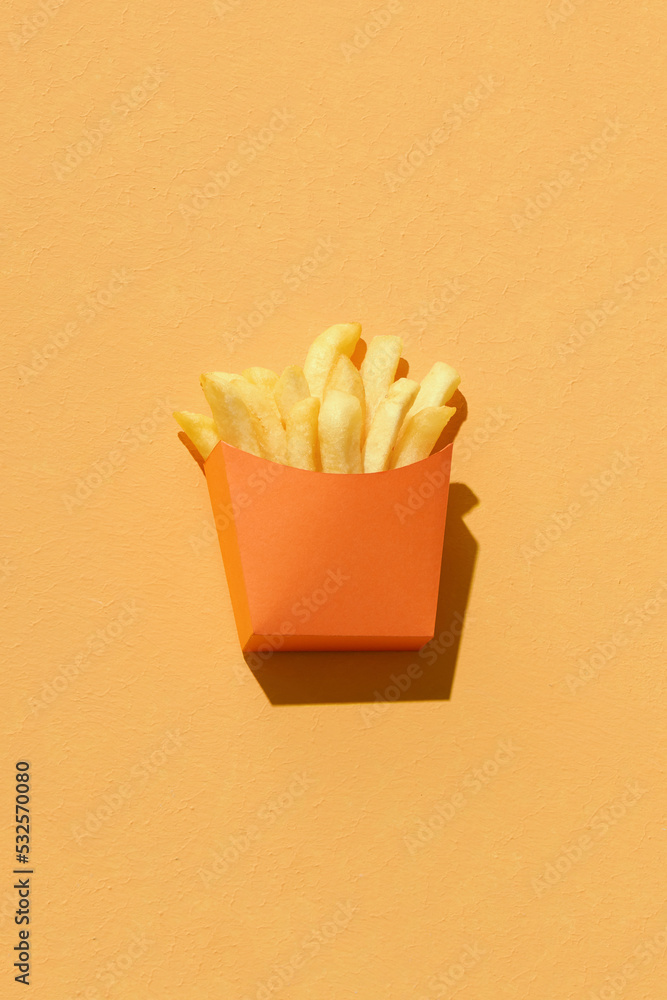 french fries in a paper cup and paper cornet Stock Photo | Adobe Stock