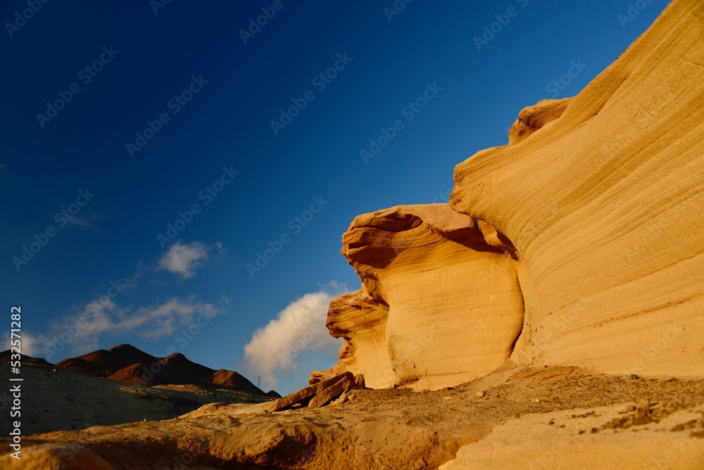 Low Angle View Of Rock Formations Against Clear Blue Sky - obrazy, fototapety, plakaty 