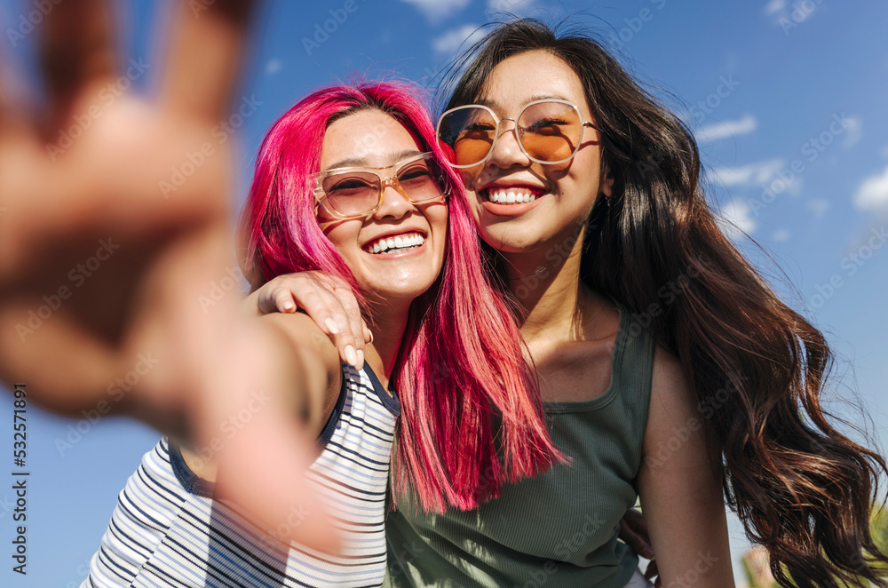 Happy stylish women taking selfie on sunny day Happy stylish women taking selfie on sunny day