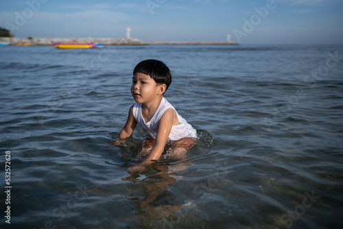 Boy soaking in sea water