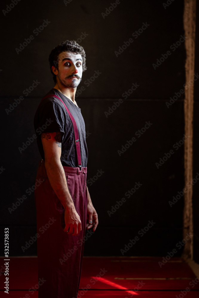 © Albert Martinez/Stocksy - Surprised clown looking at the camera