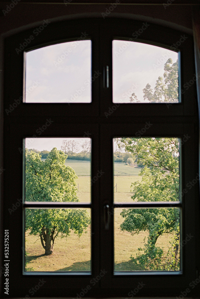 view to the countryside through the window view to the countryside through the window