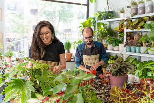 Wallpaper Mural Colleagues Working Together In A Plants Shop. Torontodigital.ca