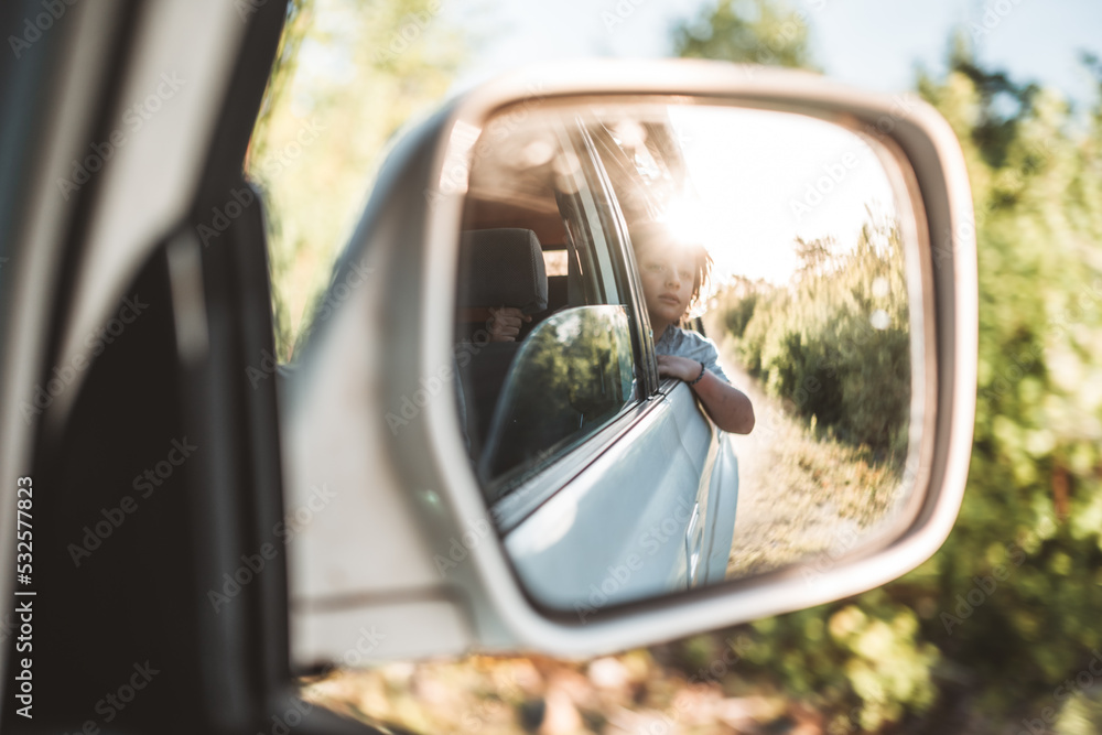 child in side view mirror child in side view mirror