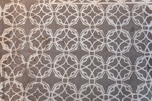 Texture background from a stucco wall covered with traditional patterns in Segovia, Spain photo