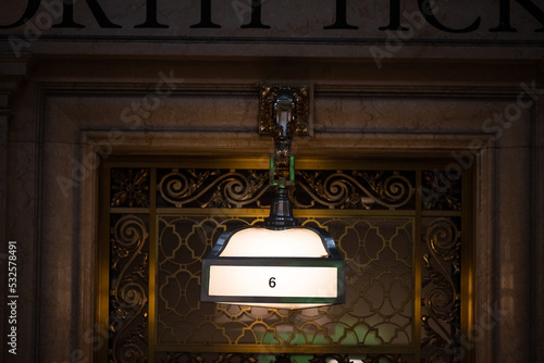Lit lamp in Grand Central Station photo
