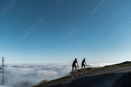 Cyclists riding on mountain trail