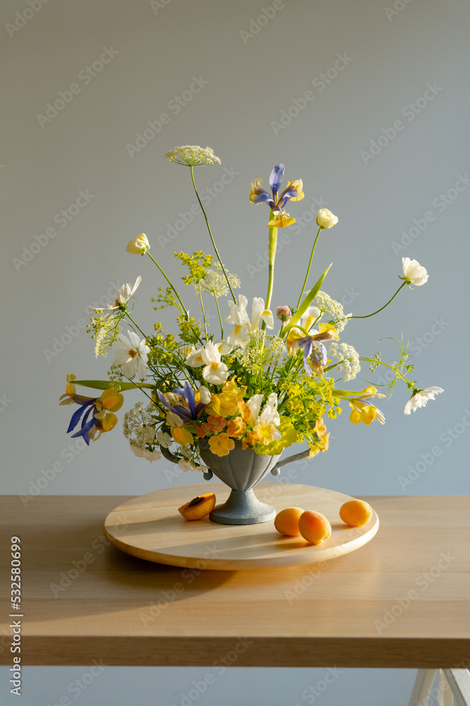 Floral Arrangement On Wooden Table In Studio
Floral Arrangement On Wooden Table In Studio