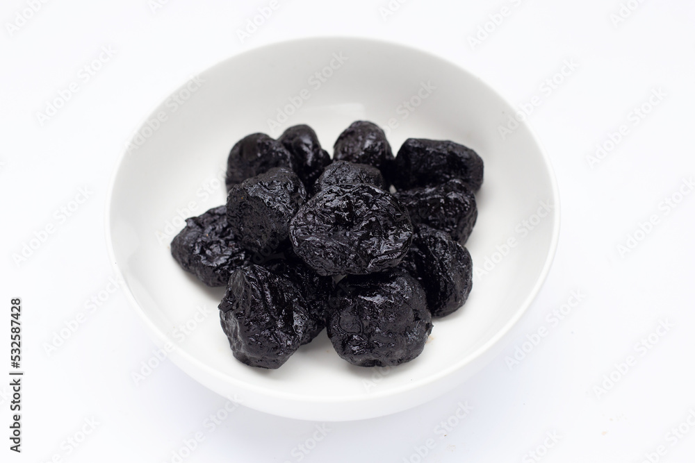 Dried prunes on white background Dried prunes on white background