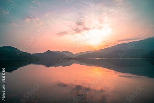 Obraz na płótnie Panorama Scenic Of Mountain Lake With Perfect Reflection At Sunrise Pink Pastel