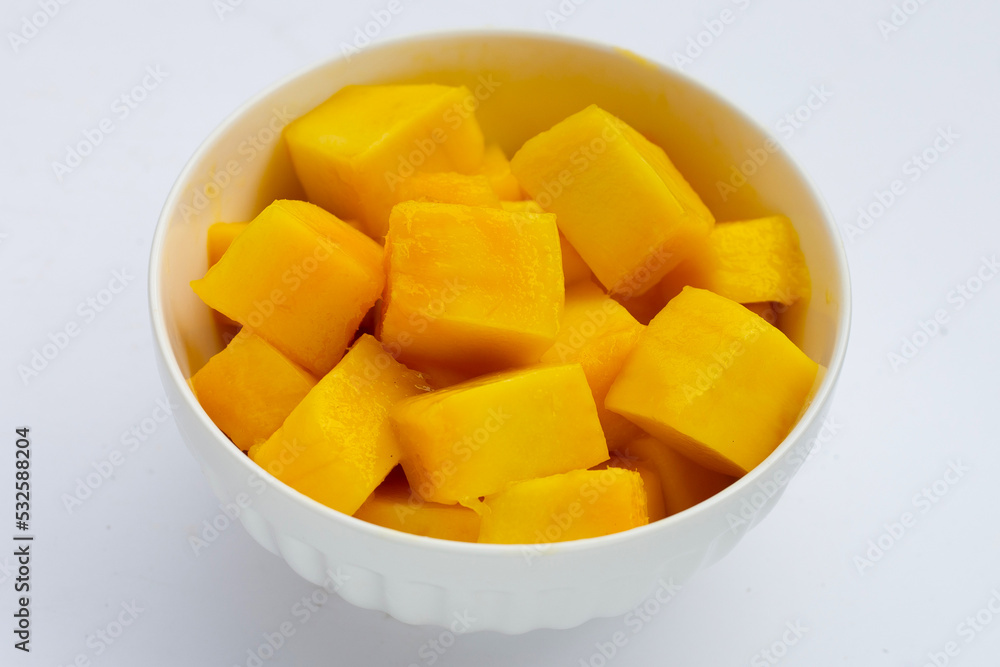 Yellow mango slices on white background. Yellow mango slices on white background.