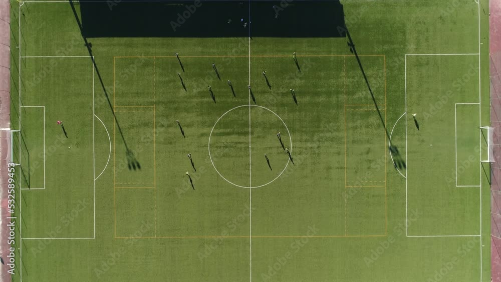 Aerial view of soccer players on the field at day Aerial view of soccer players on the field at day