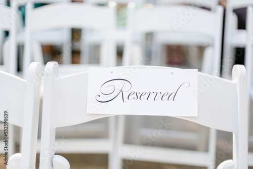 Closeup of Reserved Seating at Wedding Ceremony photo