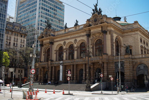 Beautiful shot of the Municipal Theatre of São Paulo, with a beautiful clear sky , historic center of São Paulo, Brazil - Vista lateral do Theatro Municipal de São Paulo, centro histórico de São Paulo