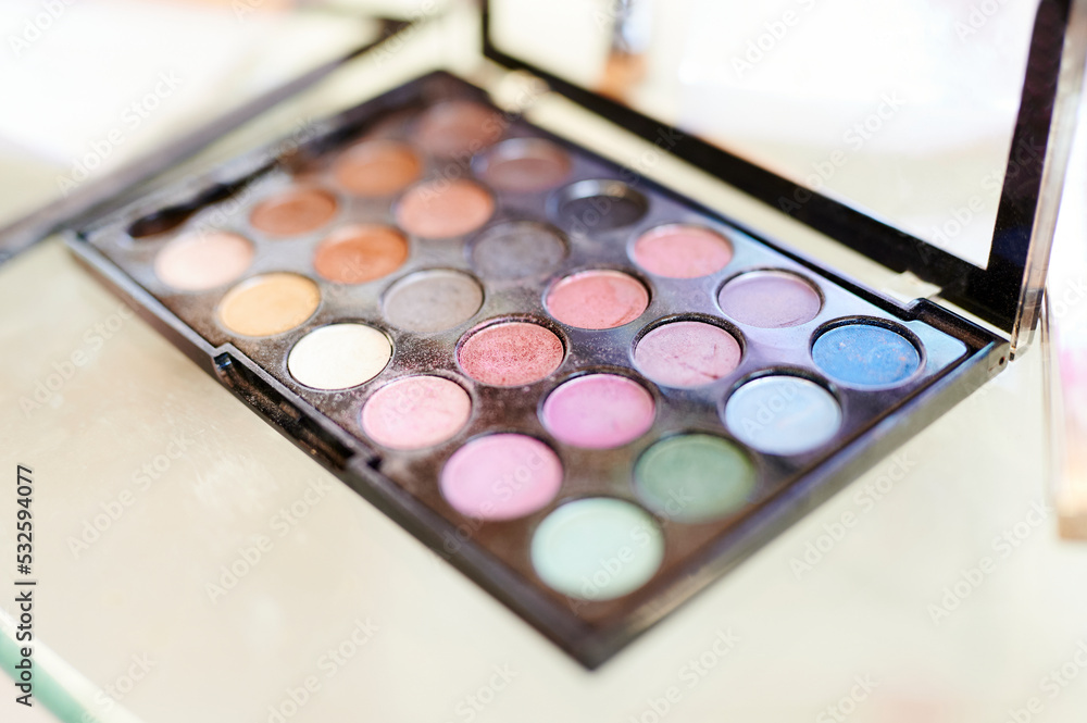 Eyeshadow palette sitting on a table Eyeshadow palette sitting on a table