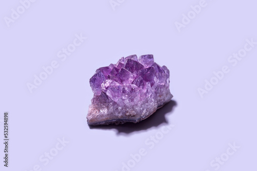 Purple amethyst gemstone with rough surface