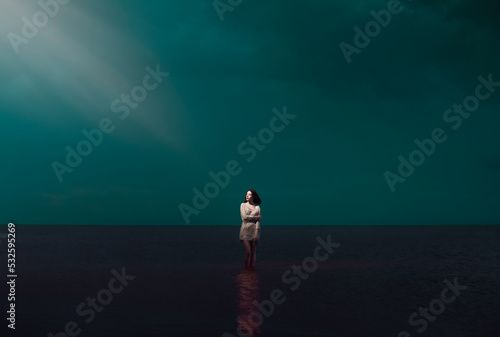 Dreamy portrait of standing woman looking at magical light