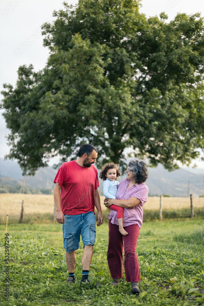 Family in the field in the mountains Family in the field in the mountains