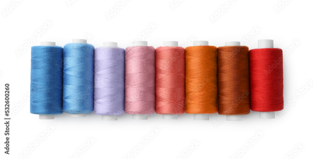 Set of different colorful sewing threads on white background, top view Set of different colorful sewing threads on white background, top view